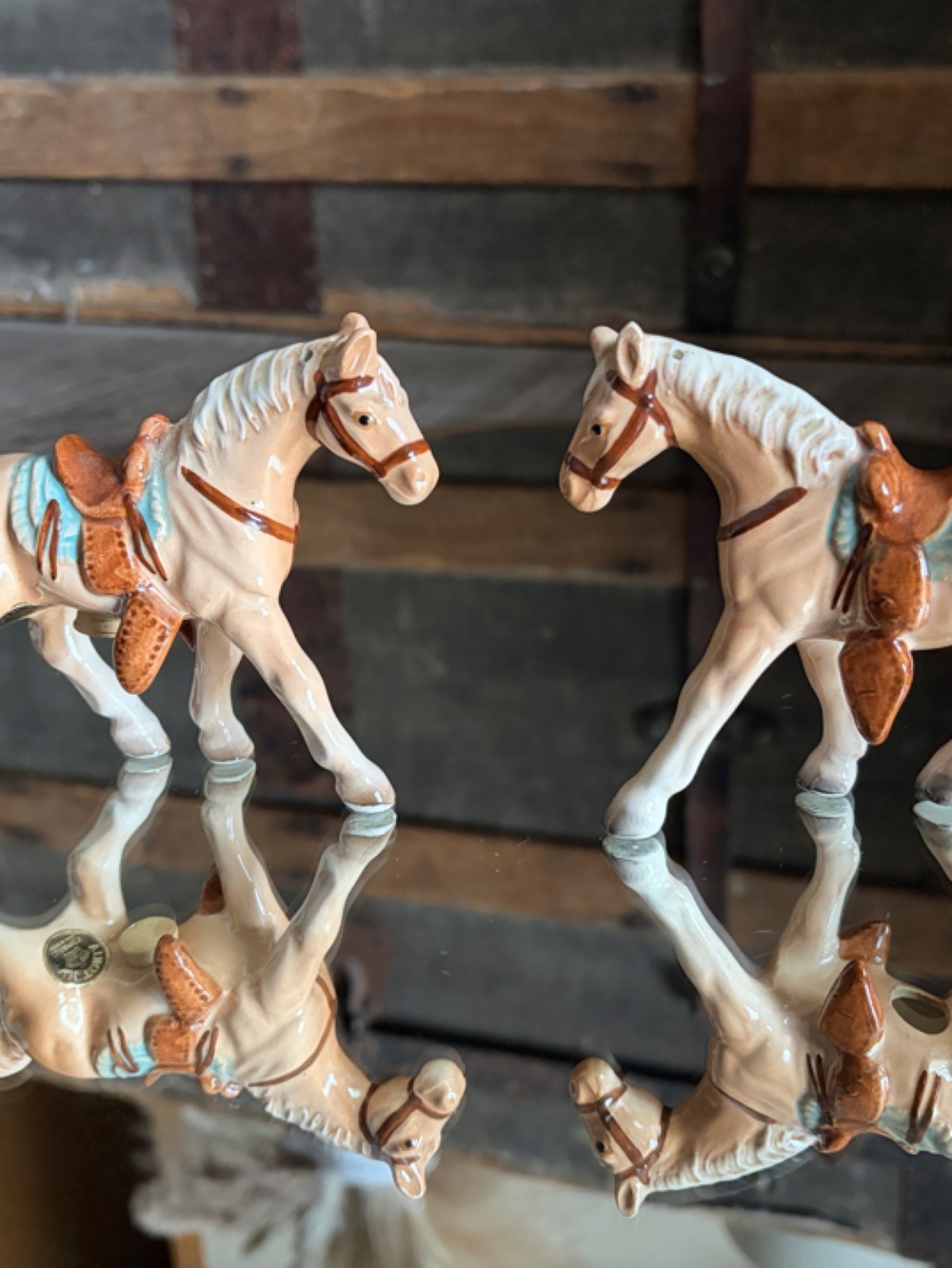Pair of Ceramic Horse Figurines in Cream with Brown Saddles